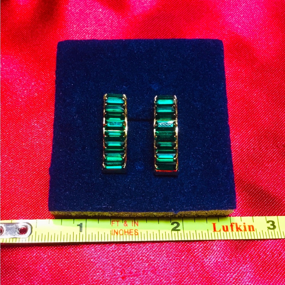 Elegant gold plated and emerald green cubic zirconia earrings.